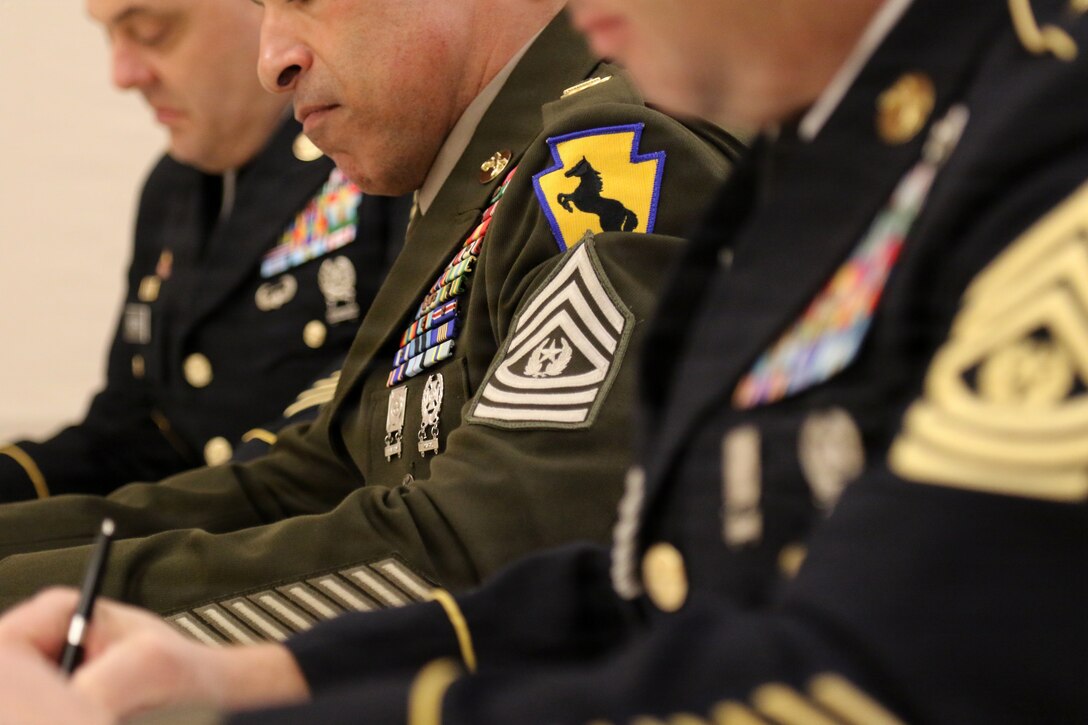 Soldiers assigned to the 55th Maneuver Enhancement Brigade, Pennsylvania Army National Guard, appear before a brigade-level Best Warrior Competition board in their Army Service Uniforms, Feb. 21, 2026. Competitors were evaluated on military bearing, professional knowledge and overall appearance for the opportunity to represent the brigade at the Pennsylvania Army National Guard’s state-level Best Warrior Competition at Fort Indiantown Gap. (U.S. Army National Guard photo by Sgt. 1st Class Shane Smith)