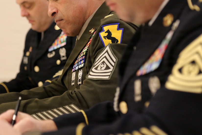 Soldiers assigned to the 55th Maneuver Enhancement Brigade, Pennsylvania Army National Guard, appear before a brigade-level Best Warrior Competition board in their Army Service Uniforms, Feb. 21, 2026. Competitors were evaluated on military bearing, professional knowledge and overall appearance for the opportunity to represent the brigade at the Pennsylvania Army National Guard’s state-level Best Warrior Competition at Fort Indiantown Gap. (U.S. Army National Guard photo by Sgt. 1st Class Shane Smith)