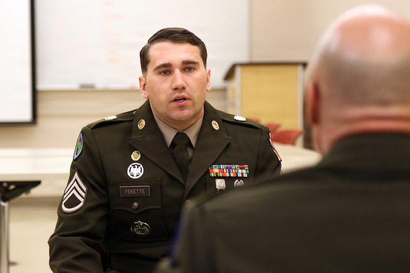 U.S. Army Staff Sgt. Storm Fekette, a military police NCO with the 1069th Military Police Company, 55th Maneuver Enhancement Brigade, Pennsylvania Army National Guard appears before a brigade-level Best Warrior Competition board Feb. 21, 2026. Competitors were evaluated on military bearing, professional knowledge and overall appearance for the opportunity to represent the brigade at the Pennsylvania Army National Guard’s state-level Best Warrior Competition at Fort Indiantown Gap. (U.S. Army National Guard photo by Sgt. 1st Class Shane Smith)
