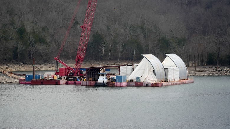 The U.S. Army Corps of Engineers Nashville District is replacing spillway gates at Wolf Creek Dam in Jamestown, Kentucky, and Center Hill Dam in Lancaster, Tennessee, to upgrade its flood risk and water management infrastructure in the Cumberland River Basin. In this photo, spillway gates are assembled on a barge at Center Hill Dam Feb. 19, 2026. (USACE Photo by Noe Gonzalez)