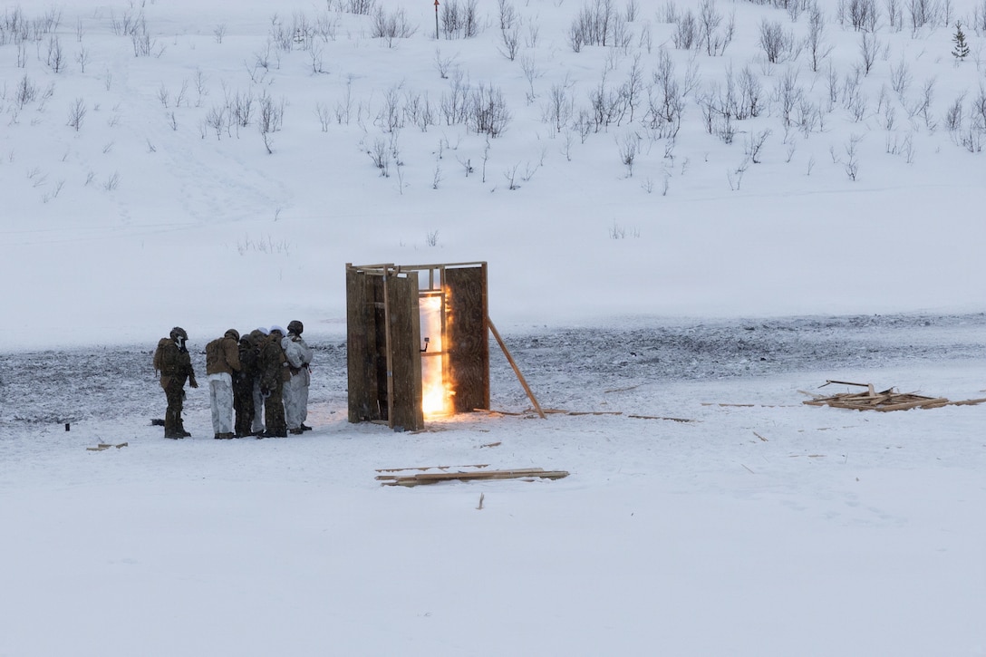 U.S. Marines with Combat Logistics Battalion 6, Combat Logistics Regiment 2, 2nd Marine Logistics Group, detonate an explosive breach on a doorway as part of an urban demolition range in Setermoen, Norway, Feb. 18, 2026. A key component of NATO's enhanced vigilance activity Arctic Sentry, exercise Cold Response 26 is a Norwegian-led winter military exercise designed to enhance collective defense capabilities and ensure U.S. readiness to rapidly deploy and seamlessly operate alongside NATO Allies in challenging arctic conditions. (U.S. Marine Corps photo by Cpl. Apollo Wilson)