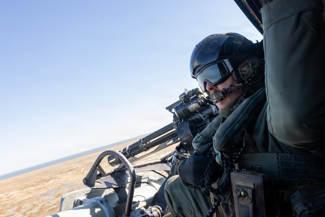 U.S. Marine Corps Gunnery Sgt. Parrish Hall II, a fixed wing aircraft crew chief with Marine Light Attack Helicopter Squadron (HMLA) 269, and a native of Michigan, rides in a UH-1Y Huey during exercise Wave Breaker at Marine Corps Air Station Cherry Point, North Carolina, Feb 6, 2026. Wave Breaker was designed to experiment with emerging counter-drone warfare. (U.S. Marine Corps photo by Lance Cpl. James Bricker)