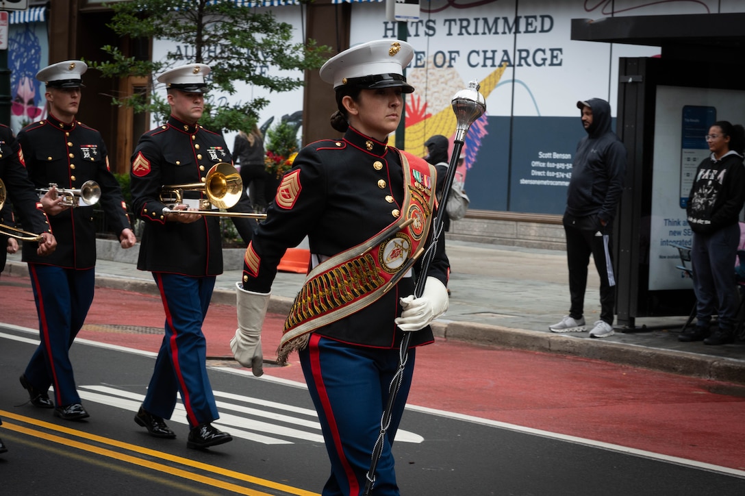 The 2nd Marine Division Band marches through the streets of Philadelphia during the Navy and Marine Corps 250 parade