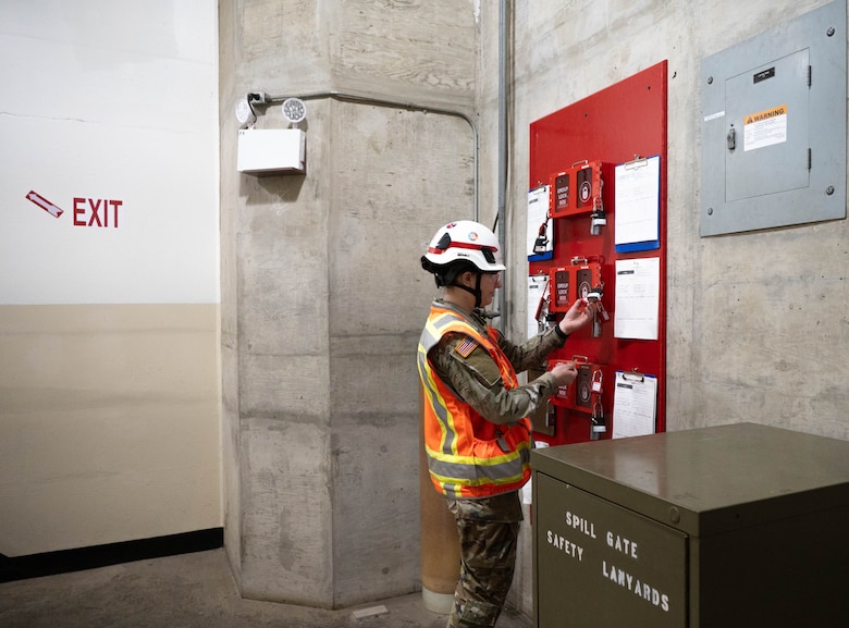 U.S. Army 1st Lieutenant, Gabby Faltin, stores keys into a secure lockbox at Folsom Dam in Folsom, California on Jan. 29, 2026. Faltin serves as an Army engineer officer assigned to the U.S. Army Corps of Engineers Sacramento District, where she applies her civil engineering background to manage projects supporting civil works initiatives. (U.S. Army photo by Bertha Smith, U.S. Army Corps of Engineers Sacramento District Public Affairs)
