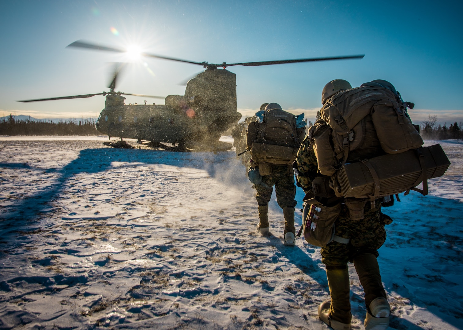 Marines prepare to board a U.S. Army CH-47 Chinook, prior to a raid on a long range radar site, at Fort Greely, Alaska, Feb. 27, 2020, during U.S. Northern Command exercise Arctic Edge 2020. AE20 is the largest joint exercise scheduled in Alaska this year. Approximately 1,000 U.S. military personnel will participate in the multi-service exercise. The exercise is conducted under the authority of North American Aerospace Defense Command and NORTHCOM. (U.S. Marine Corps photo by Lance Cpl. Jose Gonzalez)
