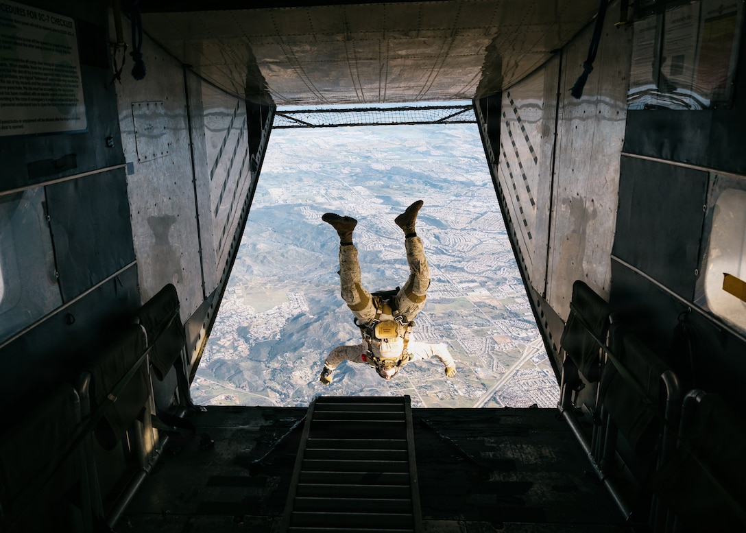 A U.S. Marine with the Maritime Raid Force, 11th Marine Expeditionary Unit, jumps from a Skyvan 3A during military free fall training in Lake Elsinore, California, Feb. 12, 2026. The training was conducted to rehearse aerial insertion tactics over difficult terrain to support expeditionary operations. (U.S. Marine Corps photo by Sgt. Joseph Helms)