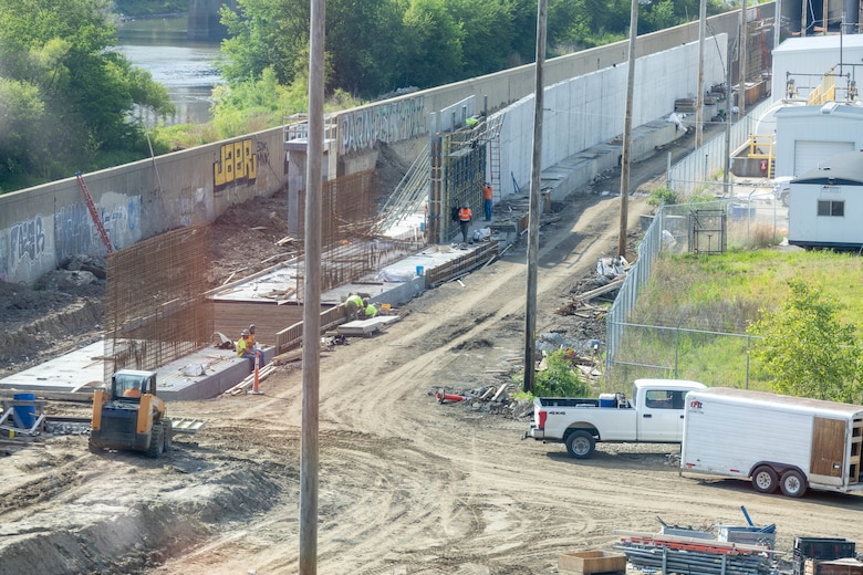Photo of vertical floodwall structures under construction in Kansas City area. Image includes rebar and concrete structures.