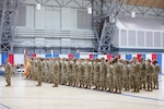 Soldiers of the 143rd Regional Support Group stand in formation during a sendoff ceremony for the unit at the Gov. William A. O'Neill Armory in Hartford, Connecticut, Feb. 21, 2026. The 143rd is scheduled to deploy to the Middle East in support of Operation Inherent Resolve. Photo by Spc. Juan Perez.