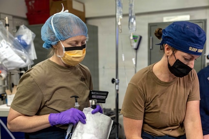 Lt. Cmdr. Rocquelle Dishaw, the ship’s nurse, left, from Sneads Ferry, North Carolina, and Cmdr. Kathryn Miller, from Chesapeake, Virginia, both assigned to Medical Department aboard Pre-Commissioning Unit John F. Kennedy (CVN 79), prepare a patient for the ship’s first at-sea surgery which occurred during Builders Trials, Feb. 1, 2026. Builder’s Trials provide an opportunity to test ship systems and components at sea for the first time, and make required adjustments prior to additional underway testing. (U.S. Navy photo by Mass Communication Specialist 1st Class Tyrell K. Morris)