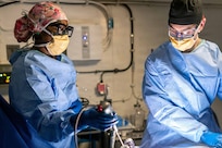 Hospital Corpsman 2nd Class Rashidah Parker, left, from Killeen, Texas, and Lt. Cmdr. James Martinson, from Sykesville, Maryland, perform the first at-sea surgery aboard Pre-Commissioning Unit John F. Kennedy (CVN 79) during Builder’s Trials, Feb. 1, 2026. Builder’s Trials provide an opportunity to test ship systems and components at sea for the first time, and make required adjustments prior to additional underway testing.  (U.S. Navy photo by Mass Communication Specialist 1st Class Tyrell K. Morris)