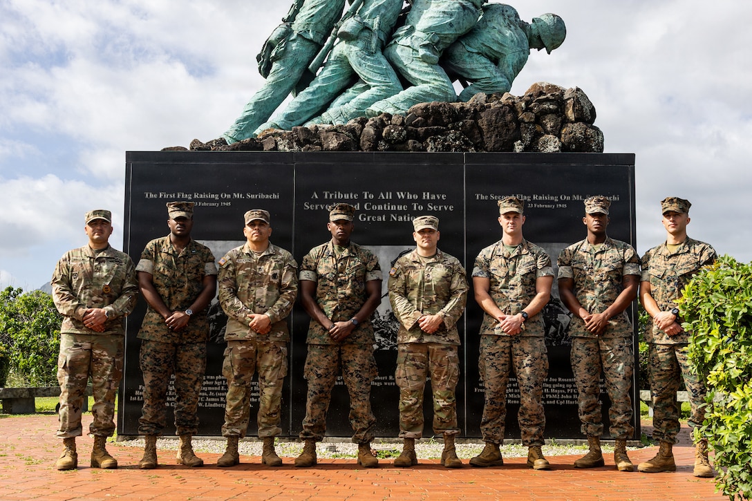 U.S. Marines with 3rd Littoral Anti-Air Battalion, 3rd Marine Littoral Regiment, 3rd Marine Division, and U.S. Army soldiers with 30th Air Defense Artillery Brigade pose for a group photo after participating in an Air Defense Artillery Fire Control Officer (ADAFCO) course on Marine Corps Base Hawaii, Jan. 15, 2026. The certification of ADAFCOs within 3rd LAAB’s formation equips 3rd MLR with skilled Marines that are capable of managing and coordinating complex air defense operations, seamlessly integrating with joint service air and missile defense systems.  (U.S. Marine Corps photo by Sgt. Malia Sparks)