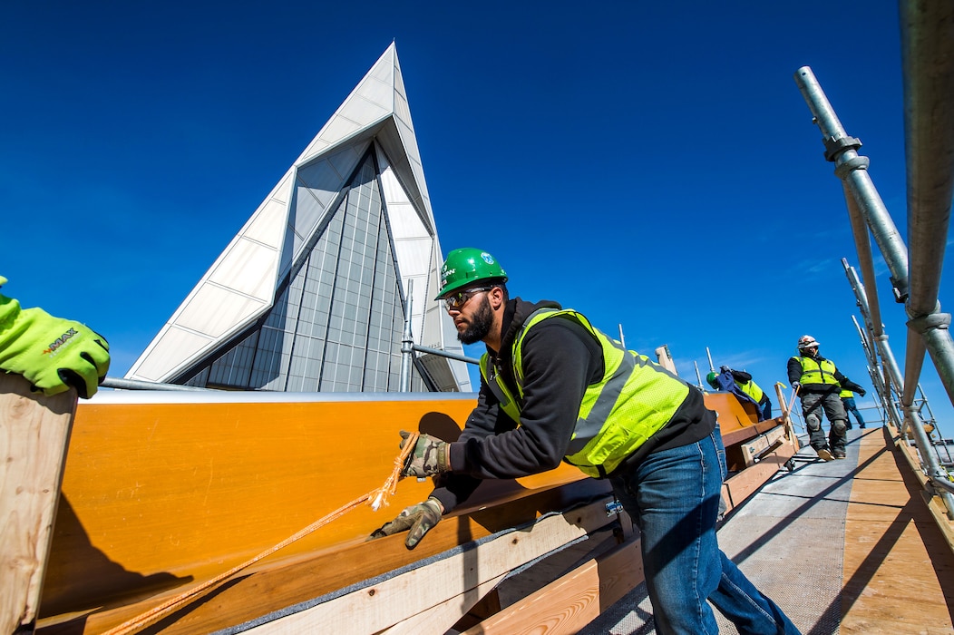 U.S. AIR FORCE ACADEMY, Colo. – Workers remove pews from the interior of the Cadet Chapel to transport into storage in preparation for renovations on Feb. 26, 2020 at the U.S. Air Force Academy in Colorado Springs, CO. The chapel closed in early September 2019 to allow for necessary repairs and is estimated to be completed in 2023. (U.S. Air Force photo/Trevor Cokley)