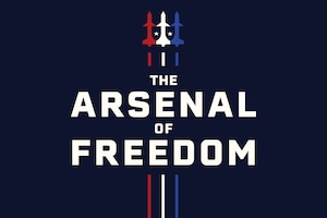 A dark blue background with the words, "The Arsenal of Freedom," centered and three aircraft vertically in the middle: one red, one white, one blue and two tiny white stars separating the aircraft.