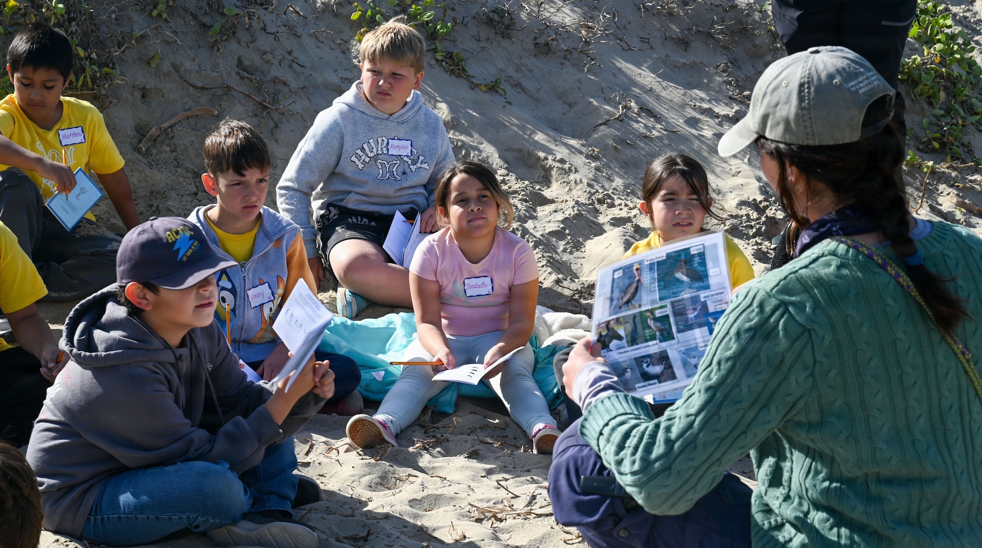 Hope Caliendo, Point Blue Conservation coastal biologist, explains the differences between bird species native to Ocean Park to students from Lompoc Unified School District.