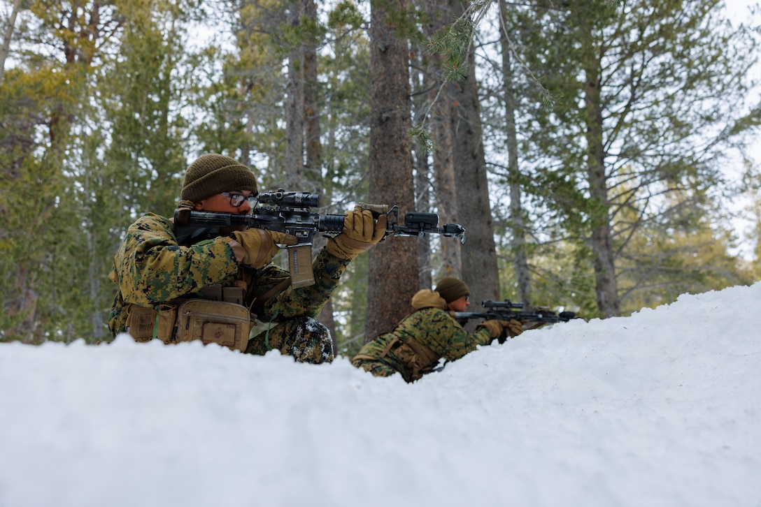 U.S. Marine Corps Sgt. Michael Perry, a squad leader with Joker Company, 2nd Battalion, 4th Marine Regiment, 1st Marine Division, holds security during Mountain Training Exercise 1-26 at Marine Corps Mountain Warfare Training Center Bridgeport, California, Feb. 7, 2026. MTX is a month-long exercise designed to prepare units to survive and operate effectively in austere, mountainous terrain, further developing character, mental, spiritual and physical endurance and resiliency. Perry is a native of California. (U.S. Marine Corps photo by Sgt. Juan Torres)