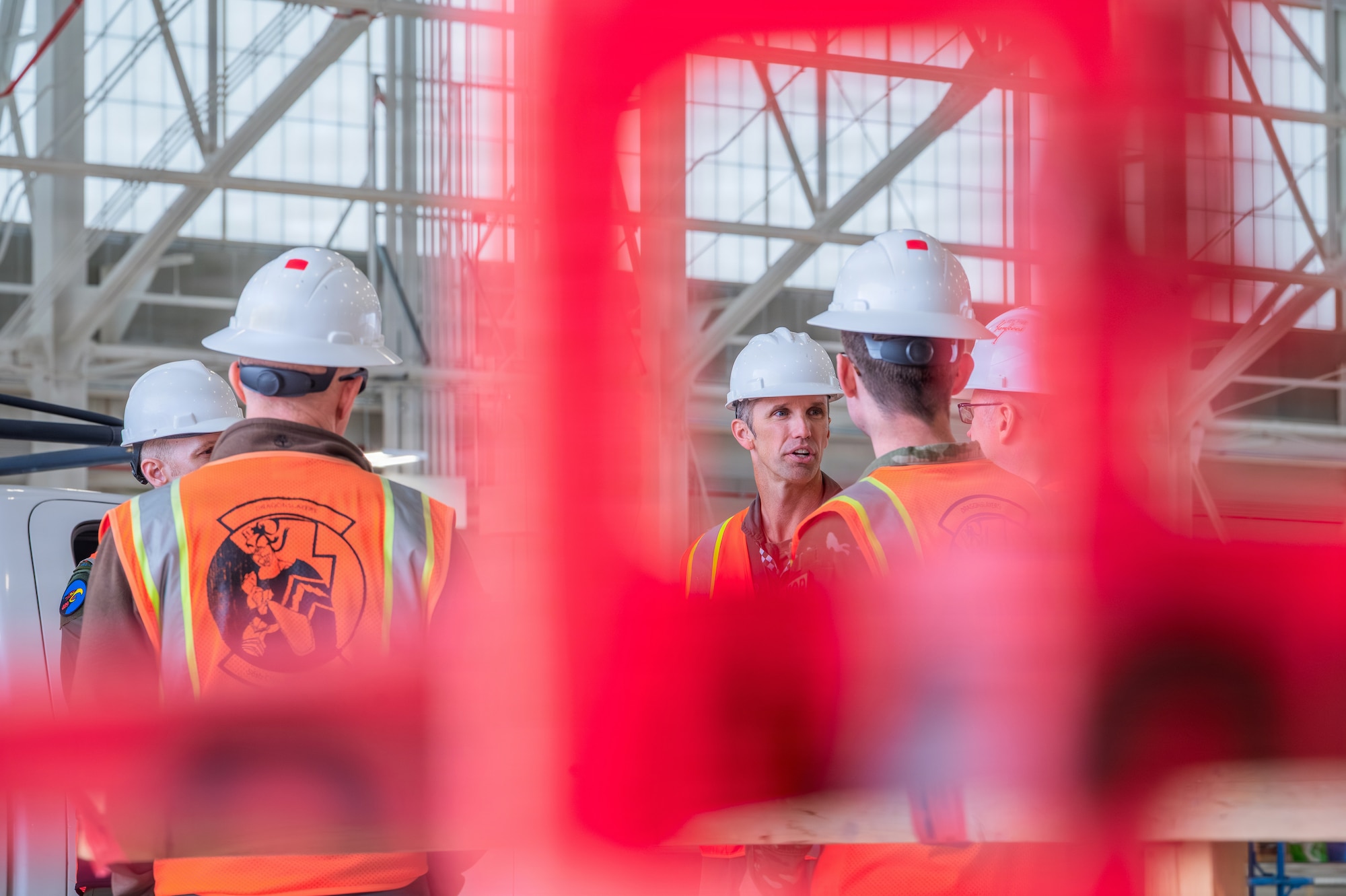 U.S. Air Force Lt. Col. Shayne Carroll (center), 308th Fighter Squadron commander, speaks with members of a Royal Canadian Air Force delegation while touring the build site for the new 309th Fighter Squadron during a base visit, Feb. 18, 2026, at Luke Air Force Base, Arizona.
