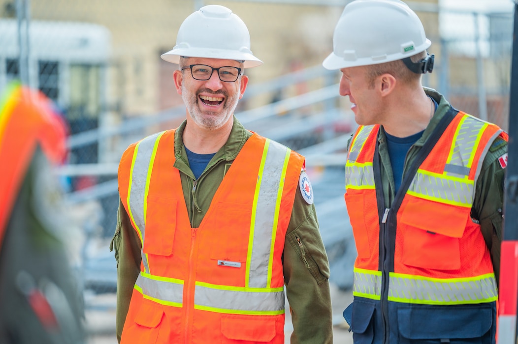 Royal Canadian Air Force Col. Barry Leonard (left), Canadian forces air and space attaché, speaks with a RCAF pilot while touring the build site for the new 309th Fighter Squadron during a base visit, Feb. 18, 2026, at Luke Air Force Base, Arizona.