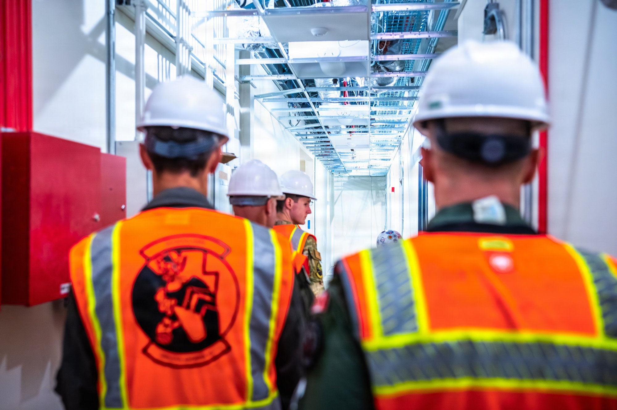 U.S. Air Force pilots and Members of a Royal Canadian Air Force delegation tour the build site for the new 309th Fighter Squadron during a base visit, Feb. 18, 2026, at Luke Air Force Base, Arizona.