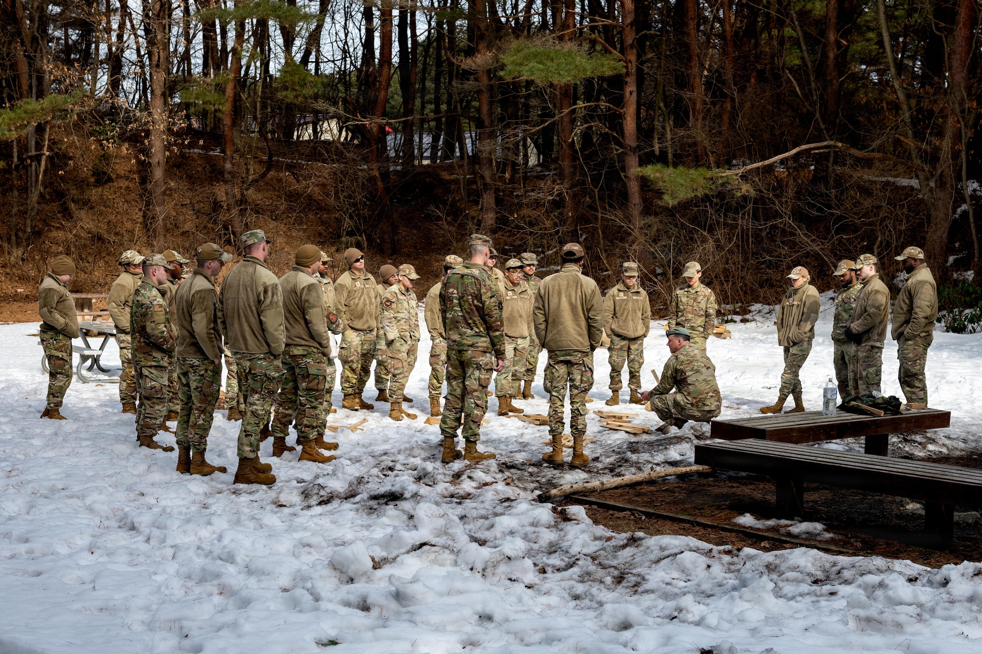 U.S. Airmen assigned to the 35th Fighter Wing learn how to make a campfire from a survival, evasion, resistance and escape specialist during an immersion tour.