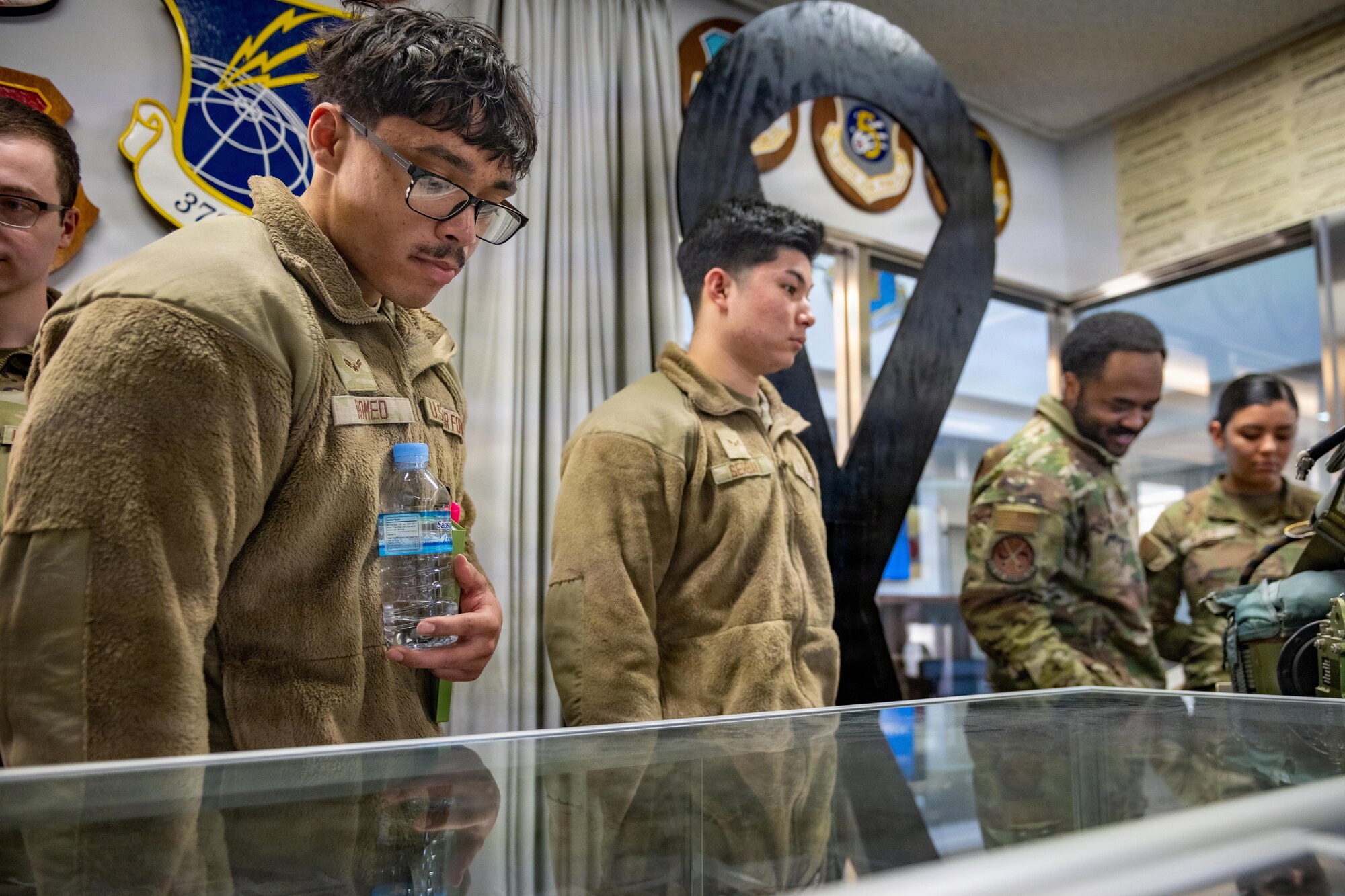 U.S. Air Force Airman 1st Class Nakobe Romeo, 35th Civil Engineer Squadron inventory technician, reads Misawa Air Base historical texts during an immersion tour.