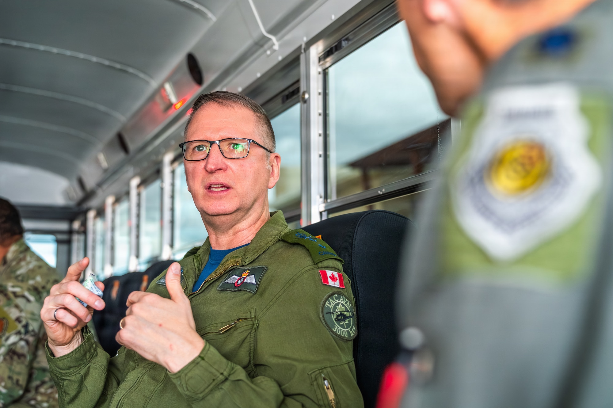 Royal Canadian Air Force Maj. Gen. Jeff Smyth, RCAF chief of air and space force development, speaks with U.S. Air Force pilots during a base visit, Feb. 18, 2026, at Luke Air Force Base, Arizona.
