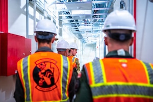 U.S. Air Force pilots and Members of a Royal Canadian Air Force delegation tour the build site for the new 309th Fighter Squadron during a base visit, Feb. 18, 2026, at Luke Air Force Base, Arizona.
