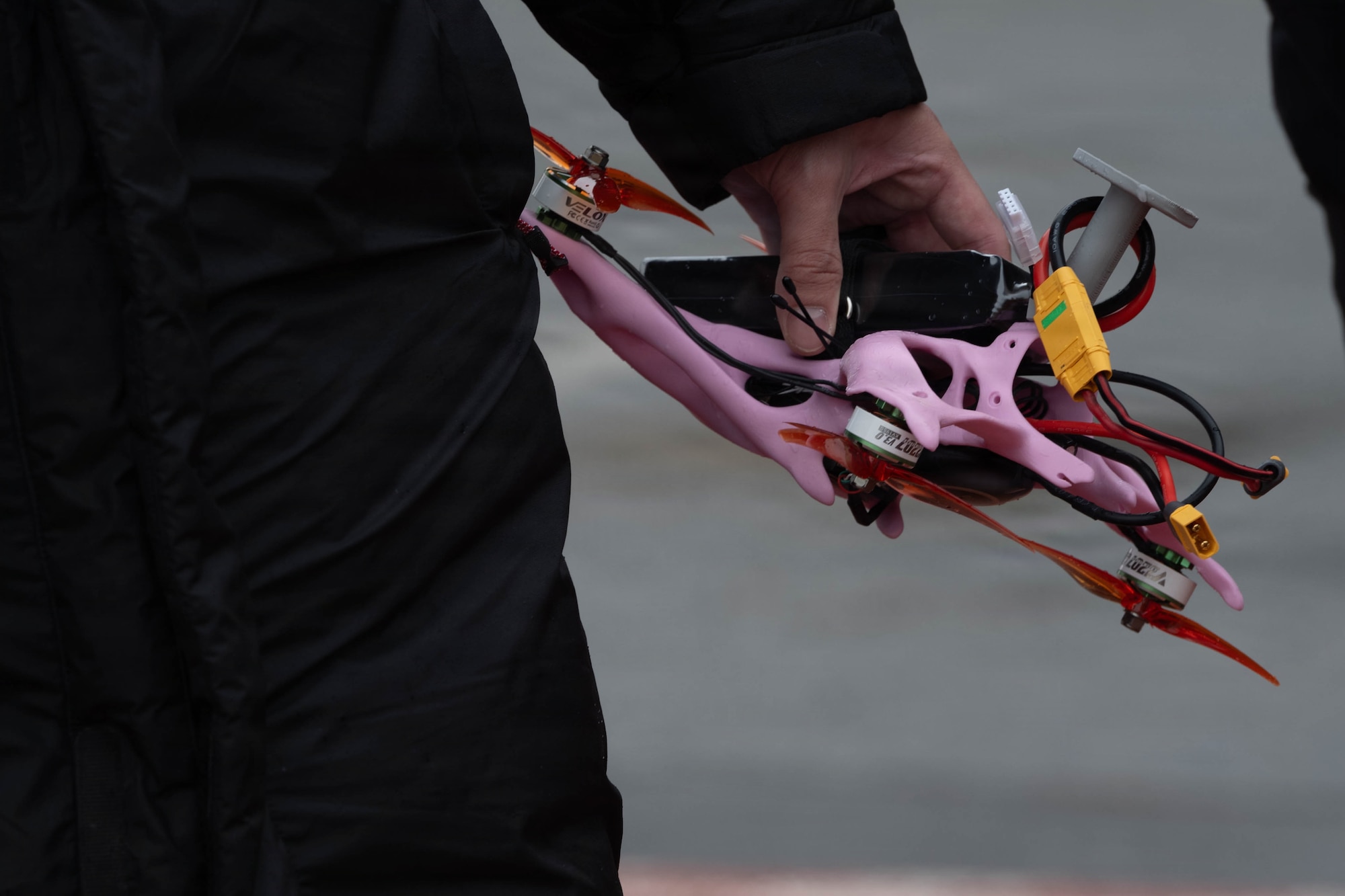 Airman holds drone.