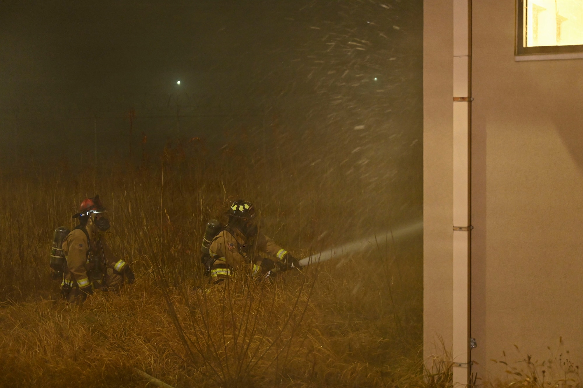 Fire fighter extinguish a simulated fire.