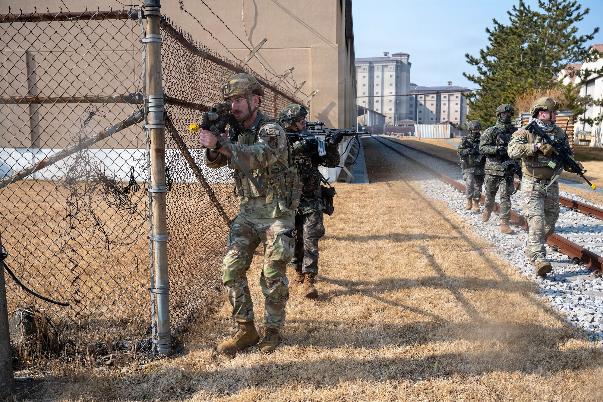 Wolf Pack Defenders and Republic of Korea Army soldiers sweep area.