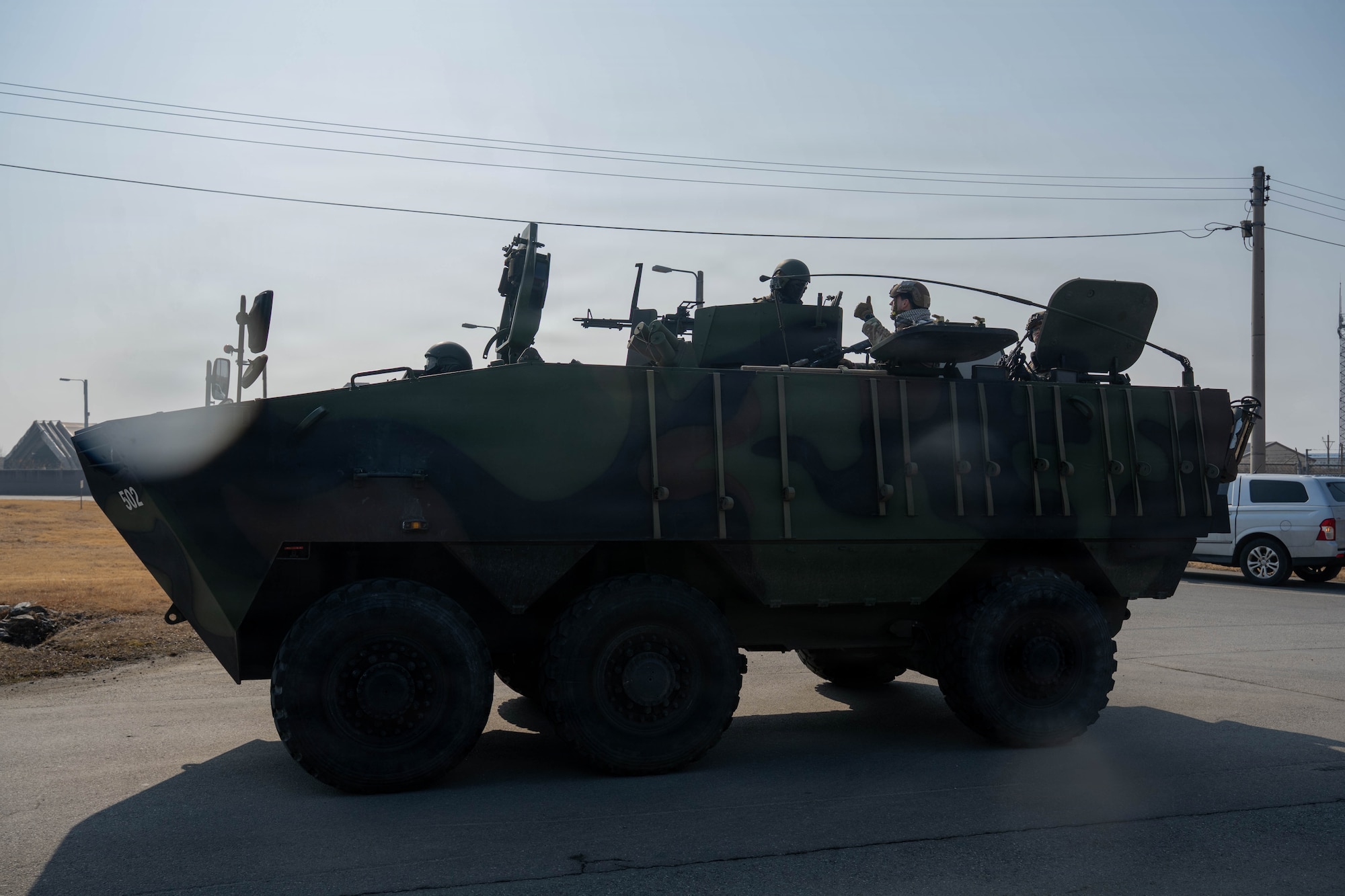 An armored personnel carrier holds service members.