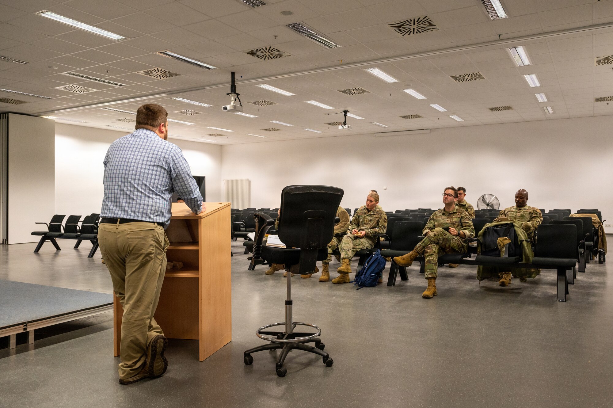 Mr. Dan Moss, U.S. Air Forces in Europe-Air Forces Africa Radiant Falcon instructor, briefs Airmen assigned to Ramstein Air Base, about aircraft radiological decontamination and response procedures at Ramstein Air Base, Germany, Feb. 12, 2026.