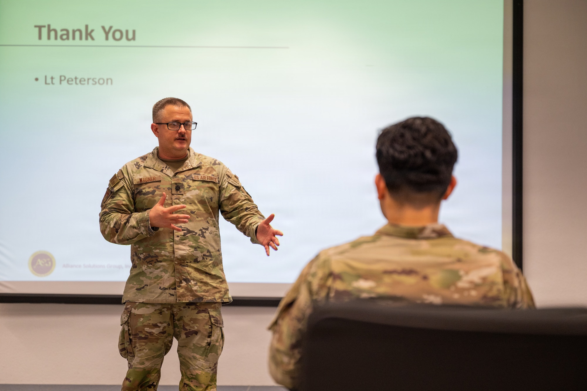 U.S. Air Force Lt. Col. Andrew Wagner, U.S. Air Forces in Europe - Air Forces Africa surgeon general bioenvironmental branch chief, delivers final remarks during a hot wash for exercise Radiant Falcon at Ramstein Air Base, Germany, Feb. 12, 2026.