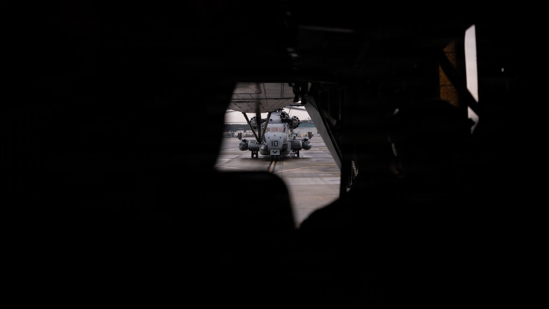 U.S. Marines with Marine Wing Support Squadron (MWSS) 271, Marine Air Control Group 28, 2nd Marine Aircraft Wing, fly aboard a CH-53E Super Stallion assigned to Marine Heavy Helicopter Squadron (HMH) 464, Marine Aircraft Group 29, 2nd MAW, at Marine Corps Air Station New River, North Carolina, traveling to Key West, Florida, Feb. 11, 2026. MAG-29 Distributed Aviation Operations Exercise is a multi-week exercise designed to distribute command and control of aviation forces, pushing authorities to the lowest levels while keeping forces moving between airfields and air sites. MAG-29 DAO Exercise is scheduled to take place across the southeastern U.S. and the Caribbean, including North Carolina, South Carolina, Georgia, Florida, and The Bahamas. (U.S. Marine Corps photo by Cpl. Anakin Smith)