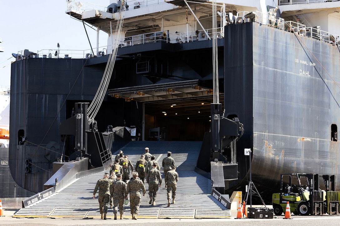 Naval Reserve Officer Training Corps students walk aboard the USNS Dahl during a Blount Island Command-hosted tour Feb. 23, 2026, at Marine Corps Support Facility Blount Island, Florida. The visit highlighted maritime prepositioning operations that support global readiness. (Official Marine Corps photo by Dustin Senger)