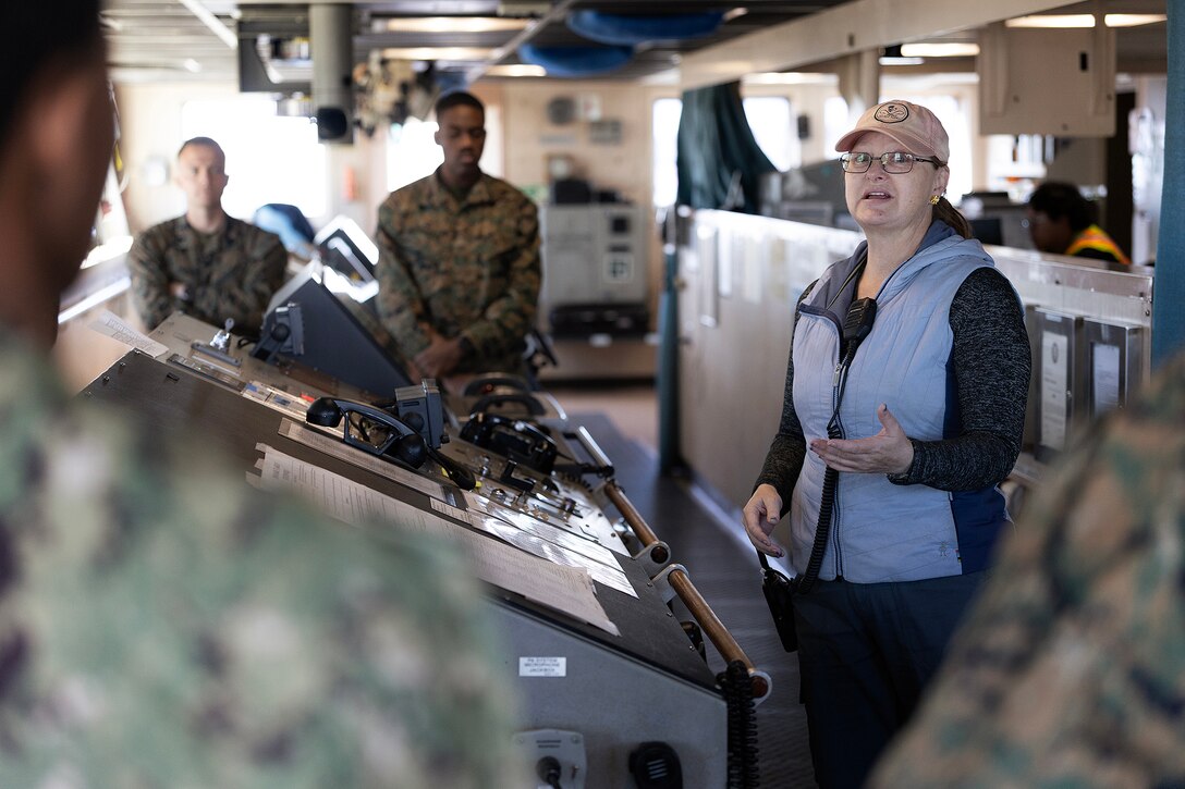 Deatra Thompson, a contracted ship captain, delivers an operations brief on the bridge of the USNS Dahl during a Blount Island Command-hosted tour Feb. 23, 2026, at Marine Corps Support Facility Blount Island, Florida. Students learned how forward-positioned maritime prepositioning ships enable expeditionary operations and global readiness. (Official Marine Corps photo by Dustin Senger)