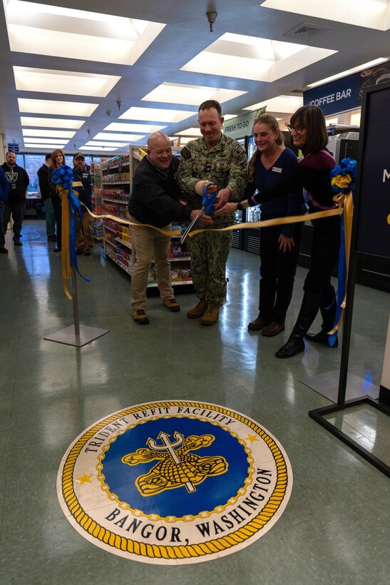 U.S. Navy Capt. Michael Eberlein and TRFB Staff cut the ribbon on the new TRFB Micromart.