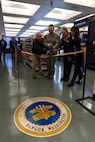 U.S. Navy Capt. Michael Eberlein and TRFB Staff cut the ribbon on the new TRFB Micromart.