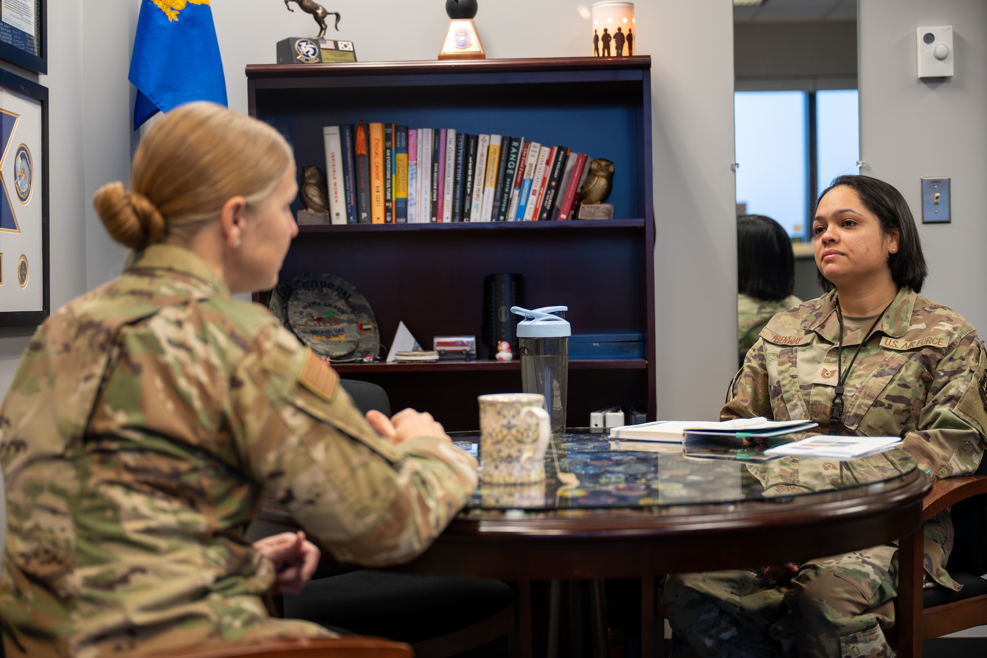 Tech. Sgt. Robin Benway, Global Exploitation Intelligence Group deputy flight chief, speaks with Chief Master Sgt. Tabatha Sanders, National Air and Space Intelligence Center command chief, at Wright-Patterson Air Force Base, Ohio, Jan. 14, 2026. The "Command Chief for a Day" shadow program is designed to lift Airmen from their day-to-day focus of their jobs and show them the strategic landscape where high-level decisions are made.