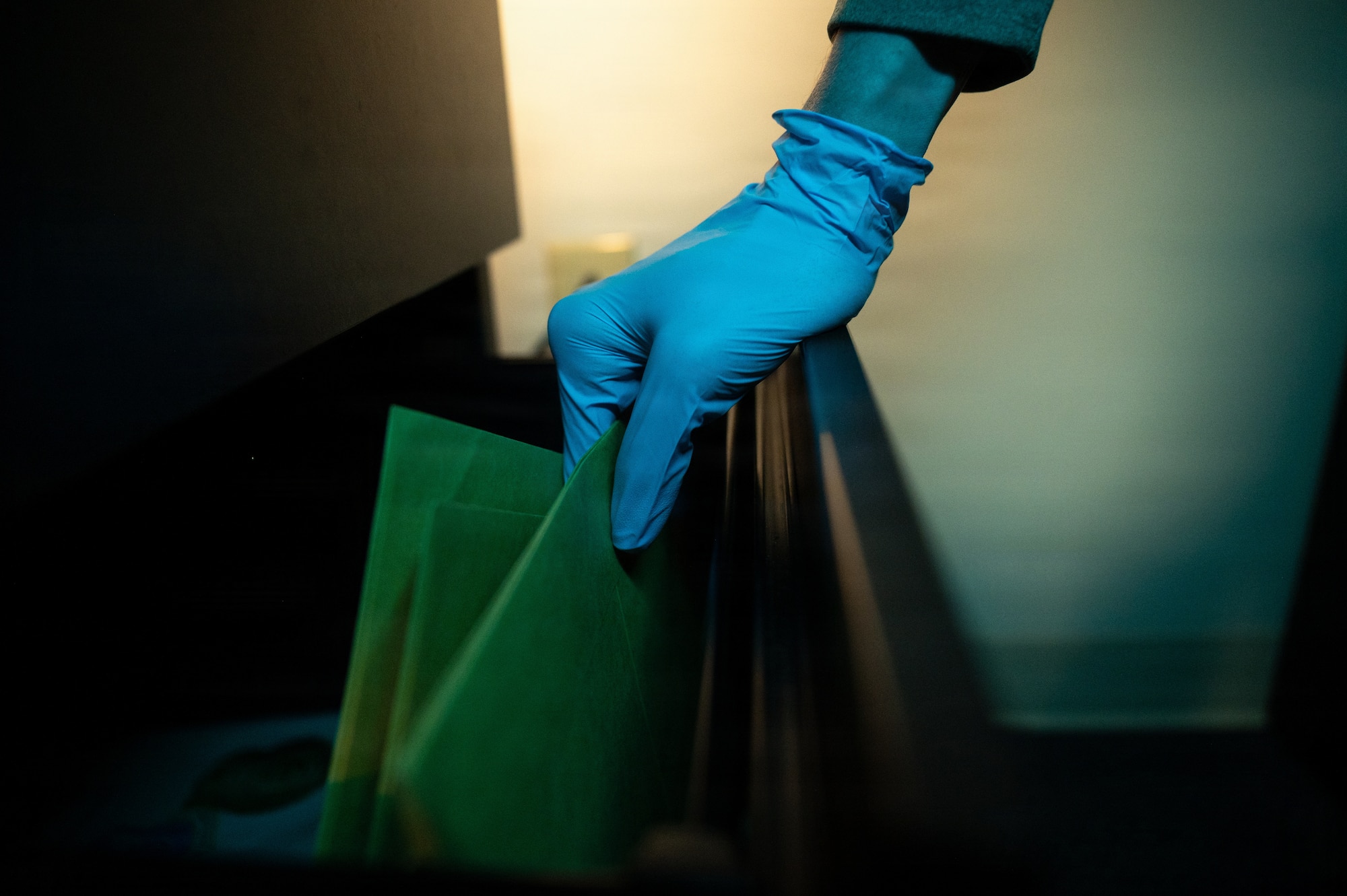A U.S. Air Force Office of Special Investigations special agent reviews investigative files during a staged photo at Seymour Johnson Air Force Base, North Carolina, Feb. 11, 2026. AFOSI conducts felony-level criminal investigations and force protection activities to help ensure mission readiness across the installation. (U.S. Air Force photo by Airman 1st Class Holly Leonard)