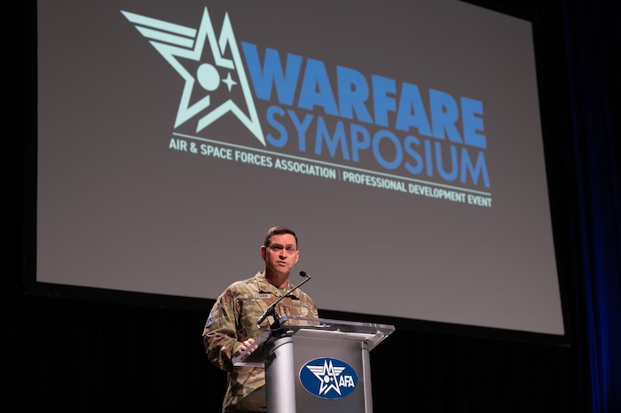 Gen Saltzman delivers a keynote at a podium