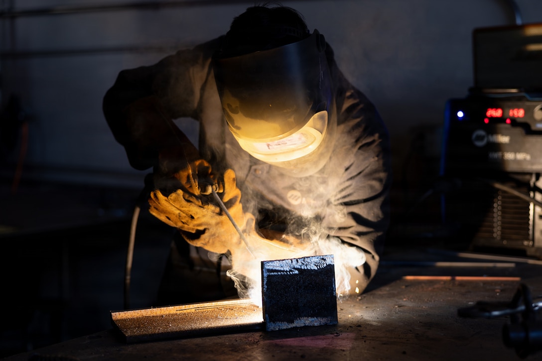 U.S. Marine Corps Cpl. Alex Morgan, a metal worker with 1st Maintenance Battalion, 1st Marine Logistics Group, practices welding techniques on Marine Corps Base Camp Pendleton, California, Feb. 4, 2026. U.S. Marines with 1st Maintenance Battalion utilize fabrication and additive manufacturing to create plastic and metal parts for innovative and cost-effective uses, increasing mission readiness across I Marine Expeditionary Force. (U.S. Marine Corps photo by Sgt. Seaira Moore)