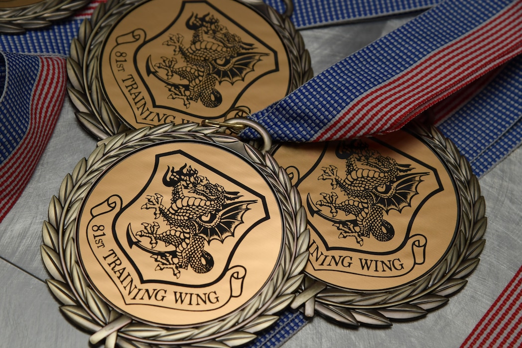 Three medallions sit on display.