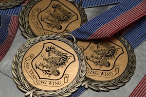 Three medallions sit on display.