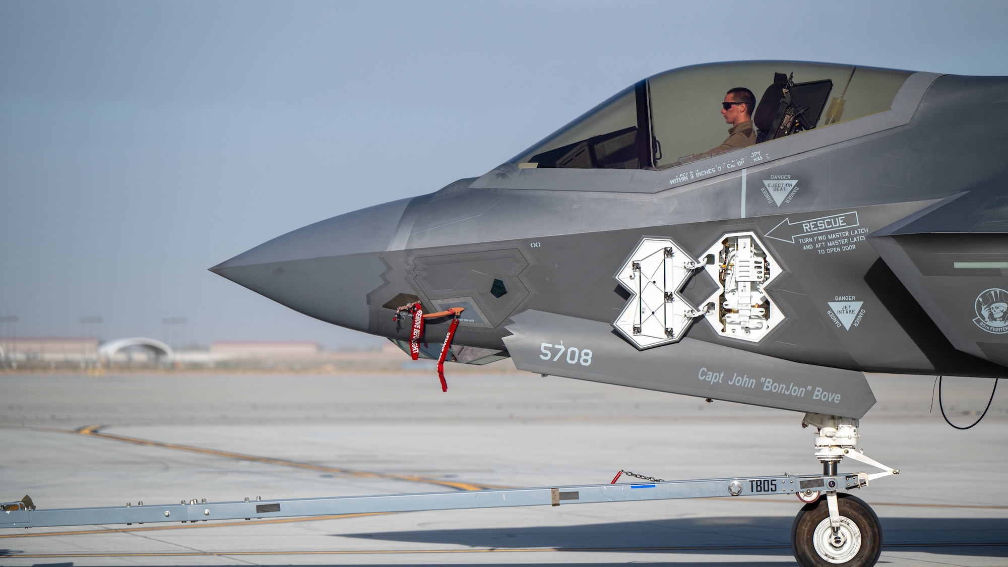 U.S. Air Force Airman 1st Class Elijah Malone, 95th Fighter Generation Squadron crew chief, steers an F-35A Lightning II during exercise Bamboo Eagle 26-1.