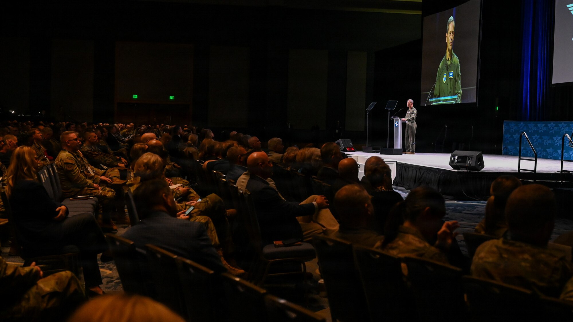 Gen. Wilsbach speaks to an audience on a stage