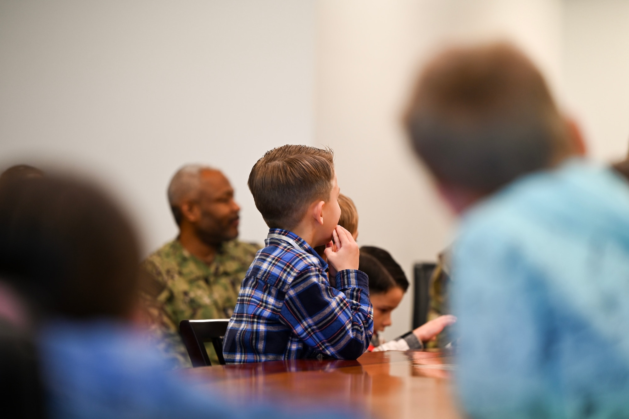 Military homeschoolers of the Lowcountry students listen to U.S. Air Force Col. Jason Parker, 628th Air Base Wing and Joint Base Charleston commander, as he shares facts about Joint Base Charleston during a wing leadership building tour at Joint Base Charleston.