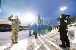 Brig. Gen. Jeffrey W. Nelson, commander of the Air Force Accessions Center and Air Force Recruiting Service, administers the Oath of Enlistment to delayed entry program members.