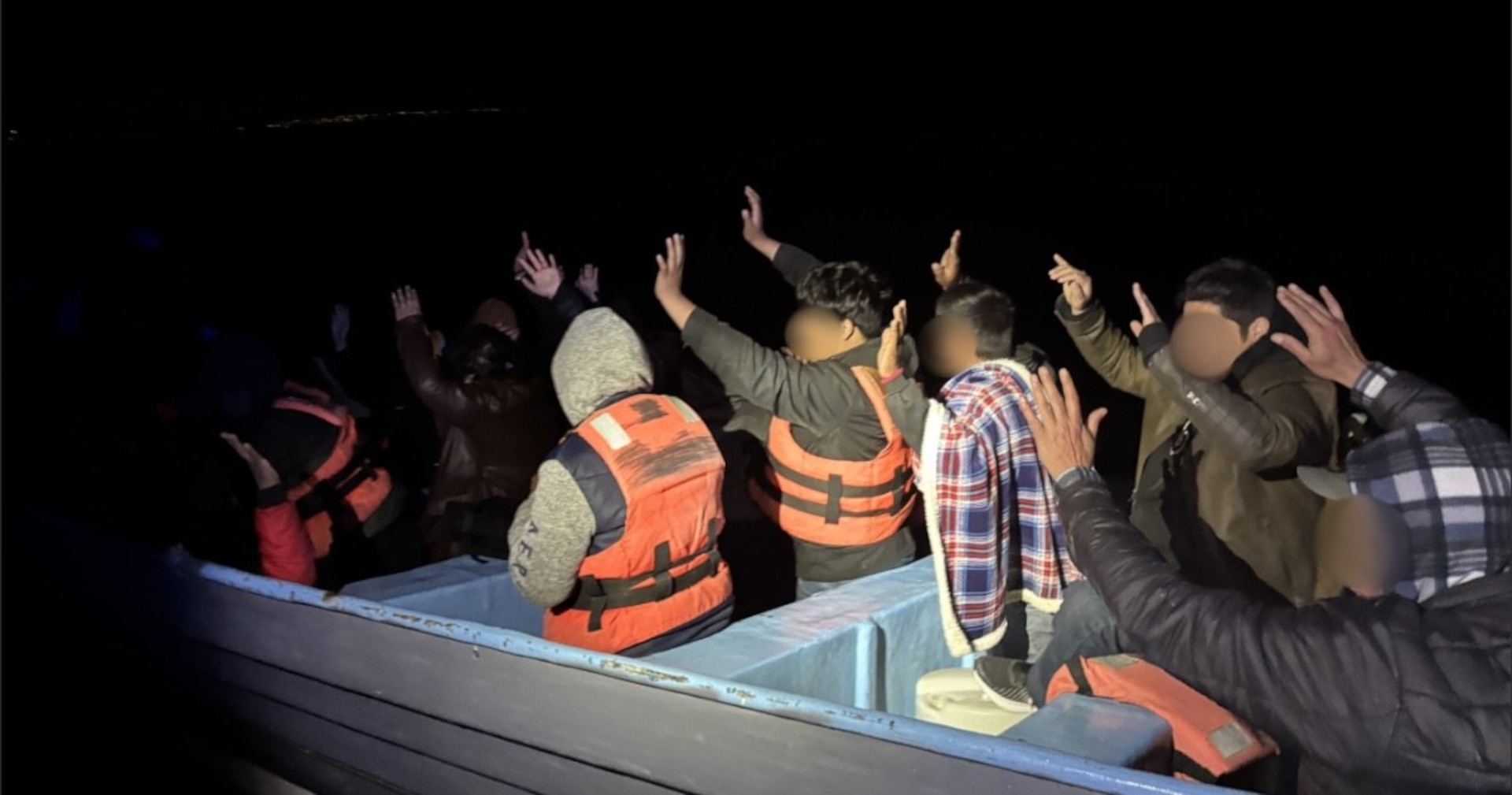 A Coast Guard Cutter Forrest Rednour boarding team interdicts a suspected alien smuggling vessel.