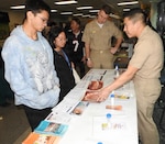 Dentists and staff members of Walter Reed’s Pediatric Dental Department and the Navy Medicine Professional Development Center provide Military Health System beneficiaries information concerning proper dental care during an open house at Walter Reed’s Pediatric Dental Department on Feb. 6 in observance of Children’s Dental Health Month.