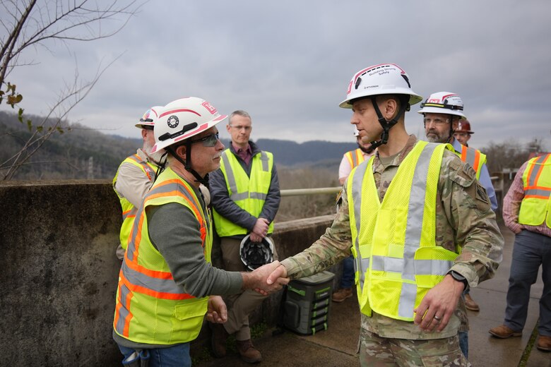LANCASTER, Tenn. (Feb. 19, 2026) – Col. Herlihy, commander of the Great Lakes and Ohio River Division (right), presents a division coin to David Darling, a safety specialist for the U.S. Army Corps of Engineers Nashville District, during a tour of the Center Hill Dam in Lancaster, Tennessee, Feb. 19, 2026. Darling was one of several team members nominated by supervisors and recognized by Herlihy during his visit for their outstanding contributions and commitment to excellence.